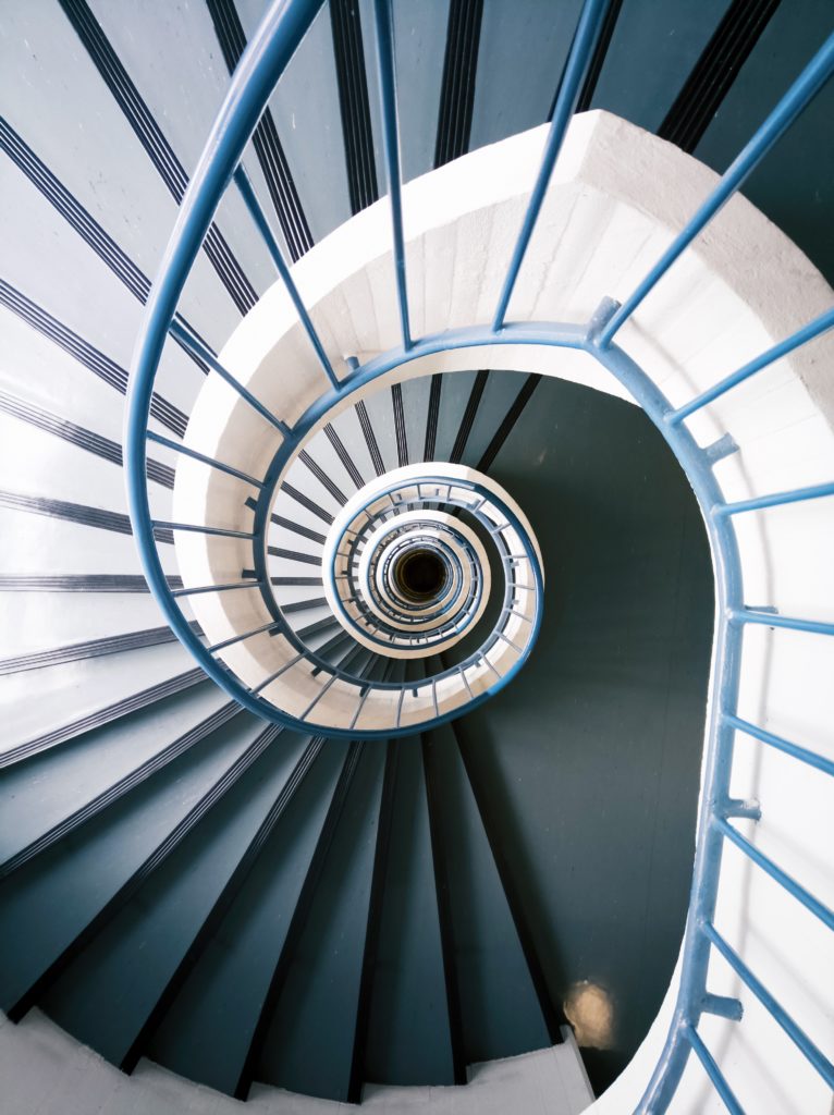 Life's meaning, spiral down to purpose, Photo by Mika Korhonen on Unsplash